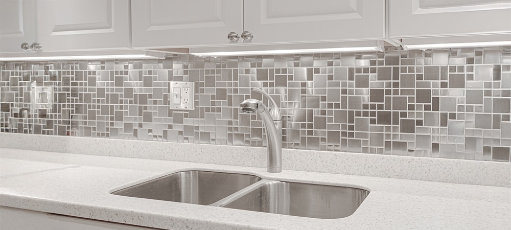 Modern white kitchen with LED under-cabinet lights